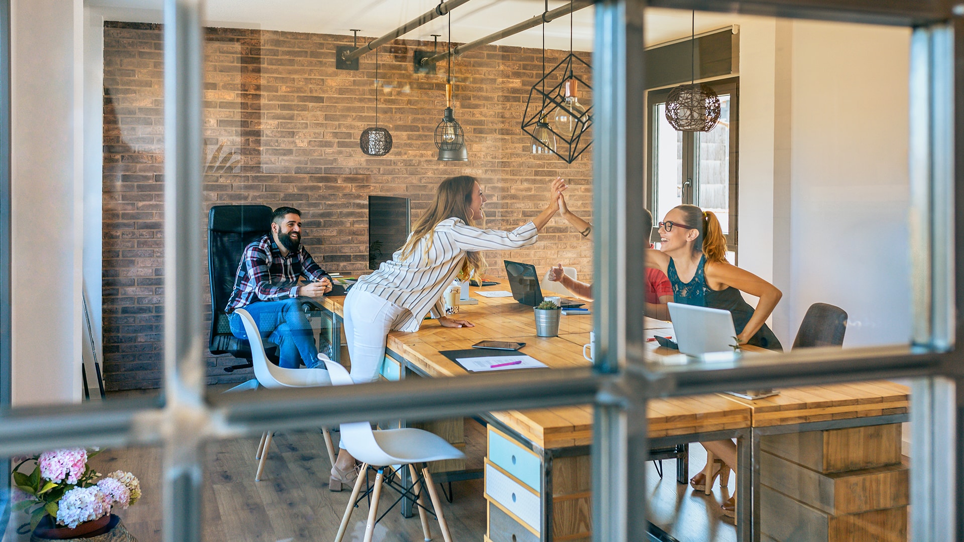 eam collaborating in a modern office with creative office furniture and innovative workspace design