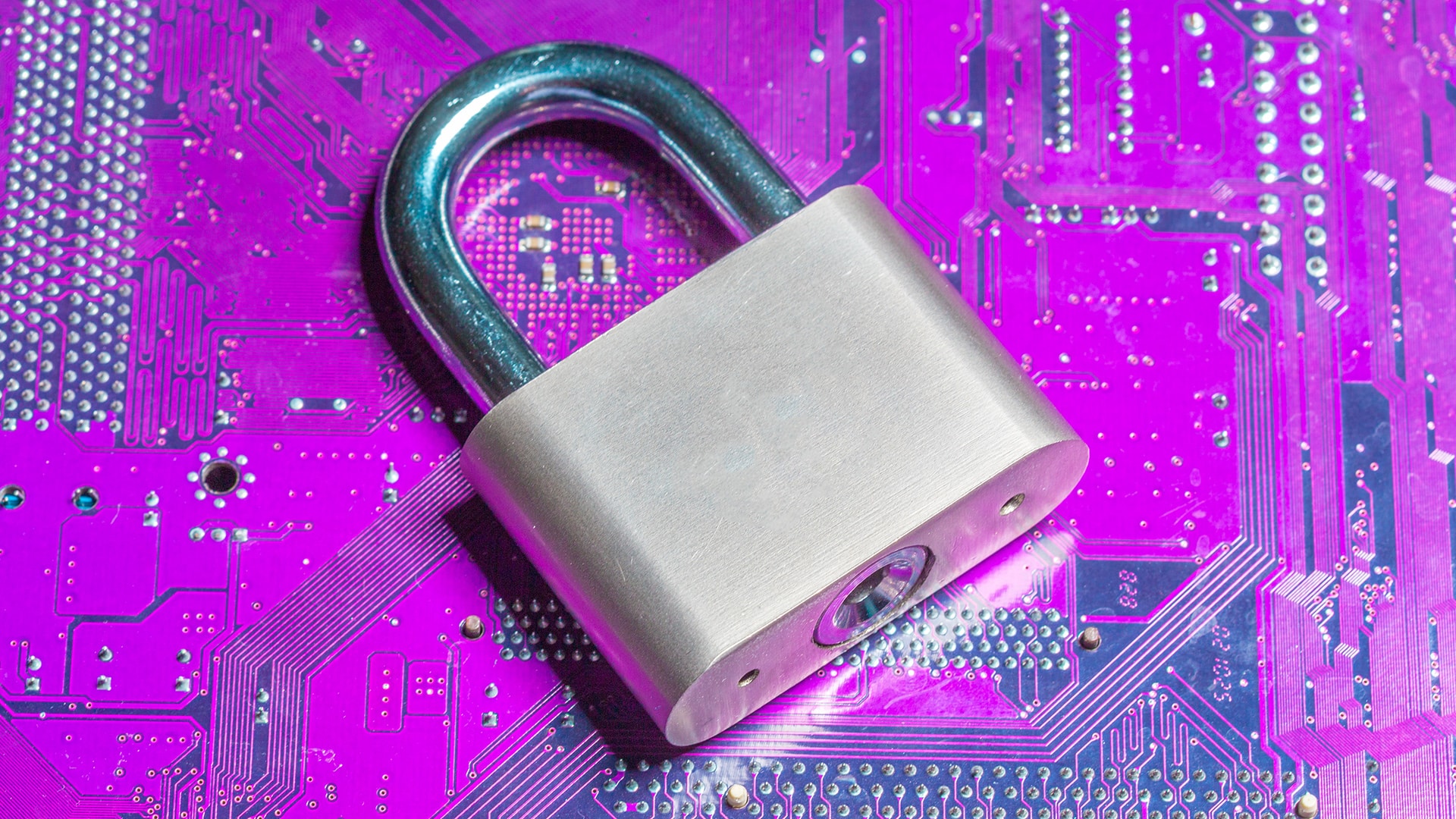 Padlock on circuit board symbolizing data leak prevention